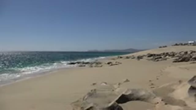 LOS CABOS MEXICO-2017: The Waves Of Ocean Arrive At The Beach And Rummaged Sand