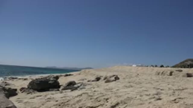 LOS CABOS MEXICO-2017: Rocky Beach Cliffside View With Rocky Mountain