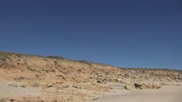 LOS CABOS MEXICO-2017: Footage Of Two Birds Flying Over Sandy Landscape On Sunny