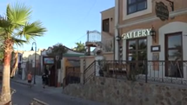 LOS CABOS MEXICO-2017: Street View Of Shops And People Walking Around With A