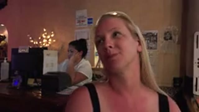 LOS CABOS MEXICO-2017: Blonde Woman In A Cozy Restaurant Dancing To Exciting Music