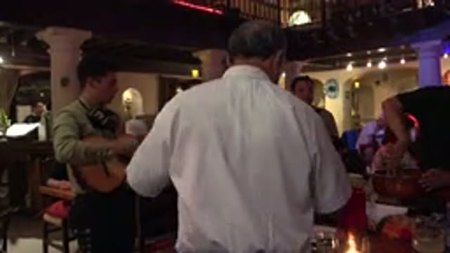 LOS CABOS MEXICO-2017: Man Sits in Restaurant While Another Prepares Food
