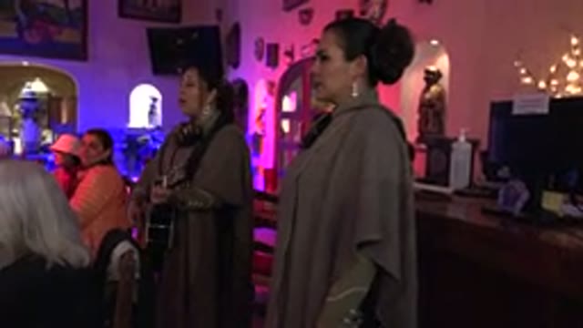 LOS CABOS MEXICO-2017: Dress Up Women Entertain People In A Pub Playing Music