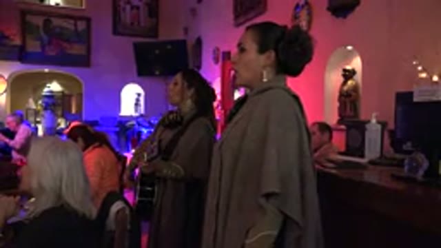 LOS CABOS MEXICO-2017: Singing A Song With A Musical Instrument In A Party