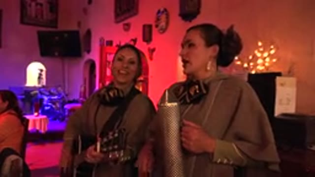 LOS CABOS MEXICO-2017: Two Women Singing And Playing Musical Instruments