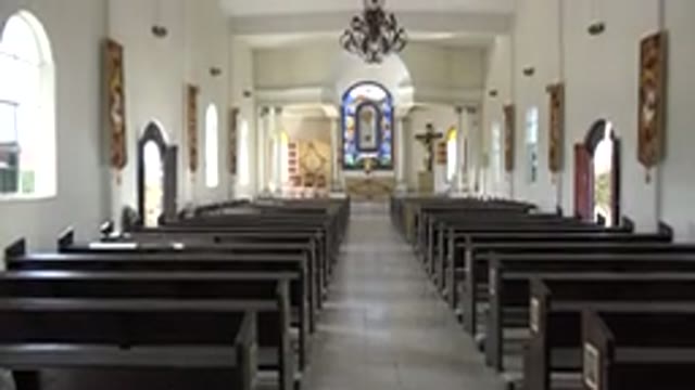 LOS CABOS MEXICO-2017: Small Church With Stained Glass Windows and Religious Paintings
