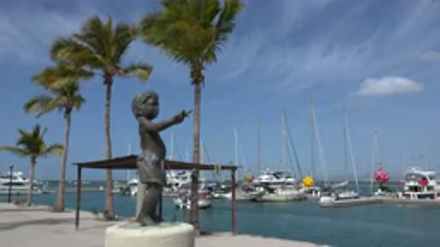 LOS CABOS MEXICO-2017: The Statue Of The Young Boy Overlooking The Sea Looks So