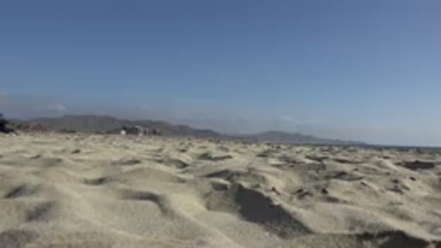 LOS CABOS MEXICO-2017: View Of Sunny Beach With Mountains In The Background