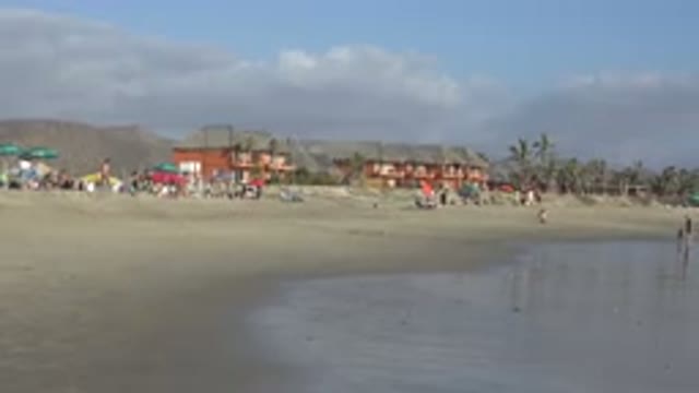 LOS CABOS MEXICO-2017: People Gathered Alongside A Body Of Water With Beach