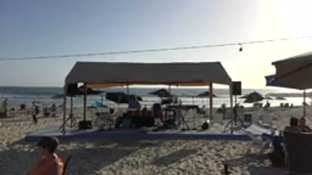 LOS CABOS MEXICO-2017: People Spending Time At The Beach By Playing Music With