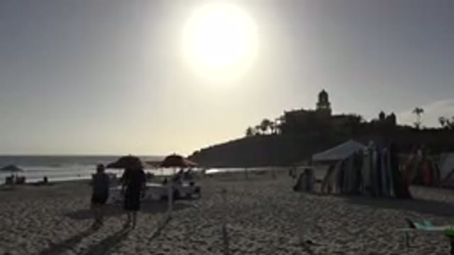 LOS CABOS MEXICO-2017: Beach At Dusk People Walking On The Sand And Having Fun