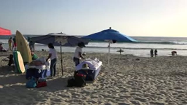 LOS CABOS MEXICO-2017: People On The Beach Enjoy The Sunset To Swim And Have Fun