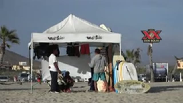 LOS CABOS MEXICO-2017: Beach Shade Pavilion White Dos Equips Palm Tree People
