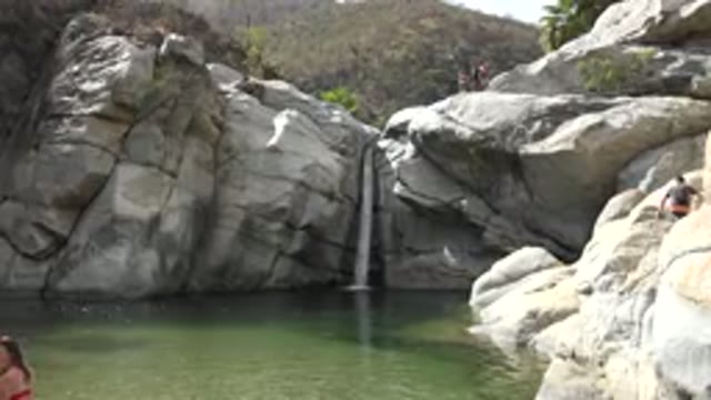 LOS CABOS MEXICO-2017: A Small Waterfall From Between Big Rocks And Big