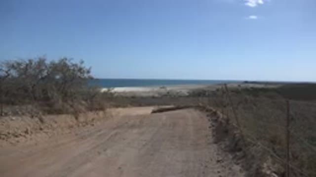 CABO PULMO MEXICO-2017: Dirt Road During The Day With Dangerous Curve Bordered