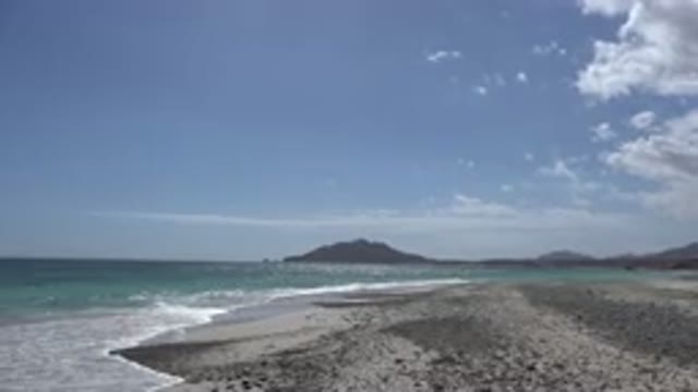 CABO PULMO MEXICO-2017: The Waves Hitting The Beach On A Calm Bright Day Looks