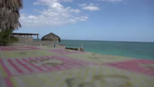 CABO PULMO MEXICO-2017: View Of The Ocean And A Beach House As A Breeze Blows