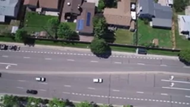 WESTMINSTER COLORADO-2017: Panning Shot From Above Wide Road Traffic Buildings