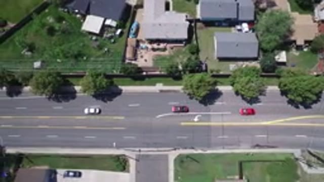 WESTMINSTER COLORADO-2017: Three Cars Drive On Low-Traffic Road Through Suburban
