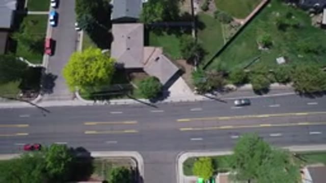WESTMINSTER COLORADO-2017: Vehicles Moving On The Road And Houses On Both Sides