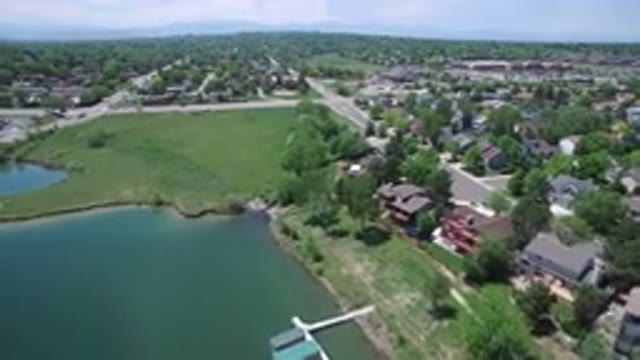 WESTMINSTER COLORADO-2017: Aerial View Of A Lake In Front Of A City With Houses