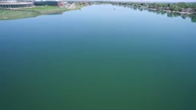 WESTMINSTER COLORADO-2017: Slow Moving Shot Of Wide Blue River Banks Visible