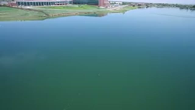 WESTMINSTER COLORADO-2017: Slow Camera Panning Across Water Surface Beach