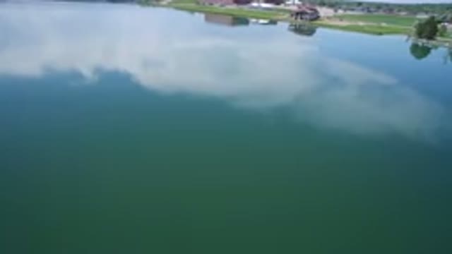 WESTMINSTER COLORADO-2017: Aerial Moving Shot Of Large Body Of Water Flat Level