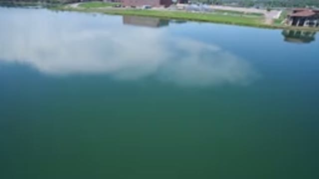 WESTMINSTER COLORADO-2017: Blue River Moving Camera Clear Skies Nice Day Green
