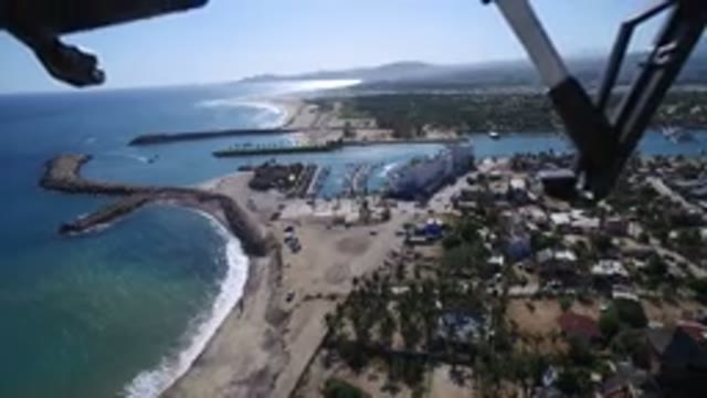 PLAYITA BCS MEXICO-2017: Drone Filming City And Trees Around A Beautiful Blue