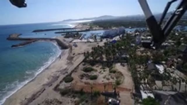 PLAYITA BCS MEXICO-2017: A Helicopter Flies Over A Tropical Beach As Waves Crash