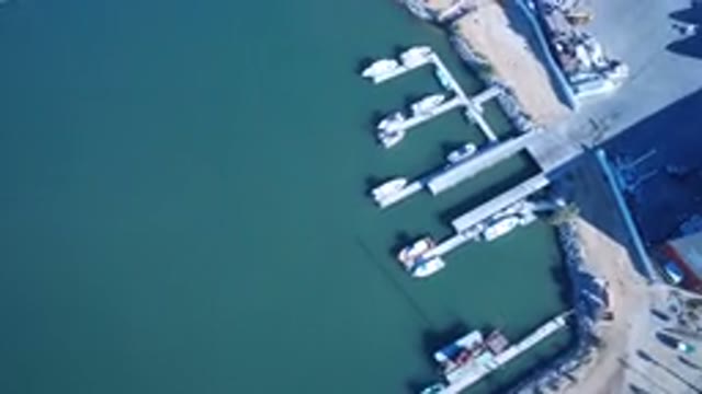 PLAYITA BCS MEXICO-2017: Pan Over Footage of a Harbor Port and Blue Water