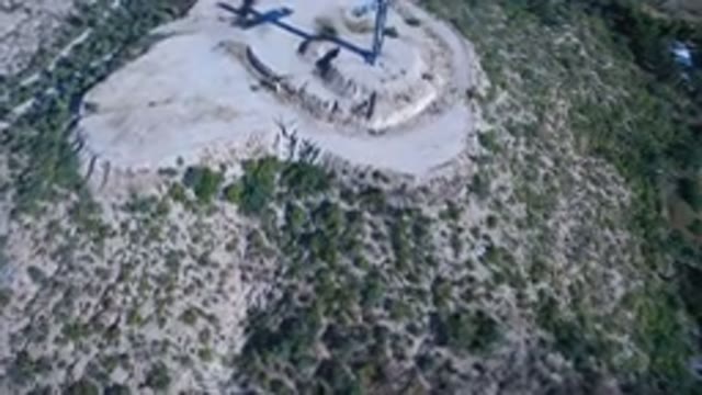 PLAYITA BCS MEXICO-2017: Aerial View Of A Cross On A Rocky And Grassy Mountain