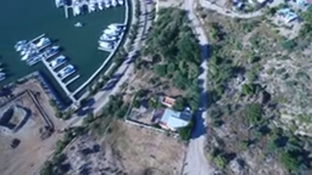 PLAYITA BCS MEXICO-2017: Aerial View of Docked Boats in Calm Waters by Curved Shoreline