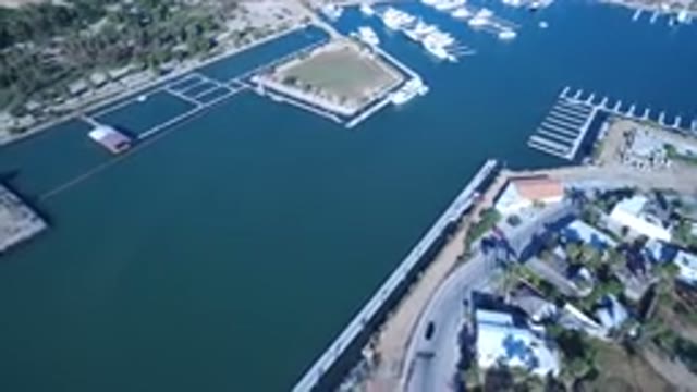 PLAYITA BCS MEXICO-2017: Aerial View Of A Large Lake With Blue Water Beside A Road
