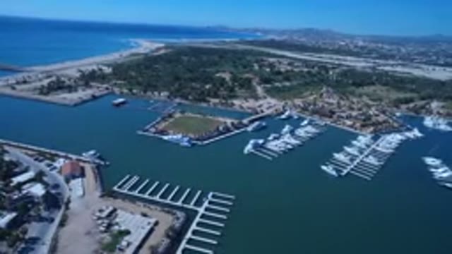 SAN JOSE DEL CABO MEXICO-2017: An Aerial View Of A City With Lots Of Boats And Water