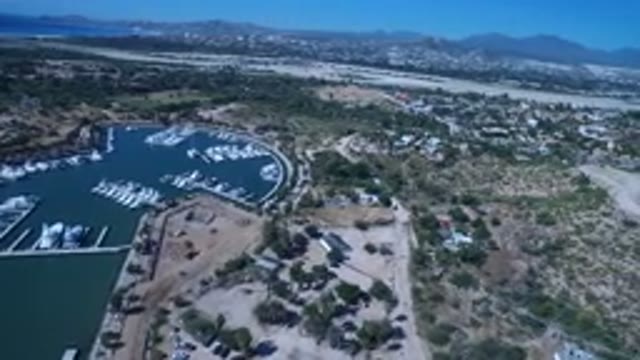 SAN JOSE DEL CABO MEXICO-2017: High Flying Drone Footage Showing Lake With Mountains and Trees