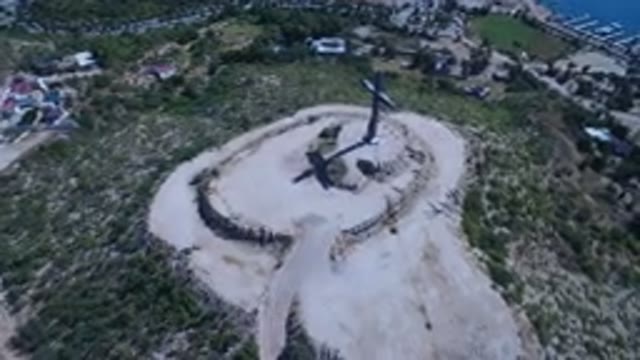 SAN JOSE DEL CABO MEXICO-2017: Blue Cross On A Hill In The Desert Aerial Shot By