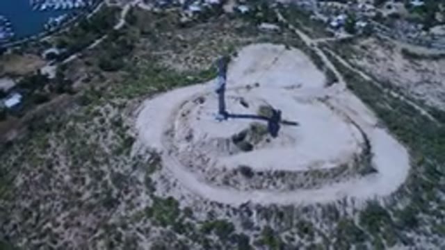 SAN JOSE DEL CABO MEXICO-2017: Big Crucifixion Stands Tall On A Rocky Grassy Hillside