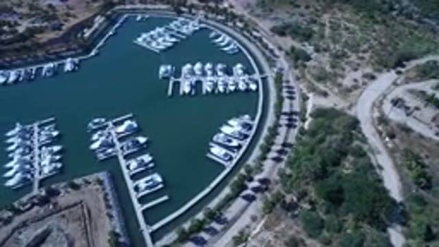 SAN JOSE DEL CABO MEXICO-2017: A Dock Filled With Boats In A Bay