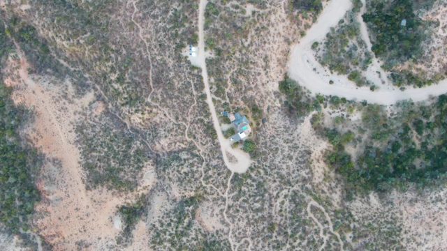 CABO PULMO BCS MEXICO-2023: Aerial of Arid Hillside with Winding Road and Structure