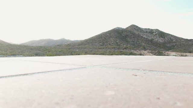 CABO PULMO BCS MEXICO-2023: Open Concrete Area with Distant Mountain Range