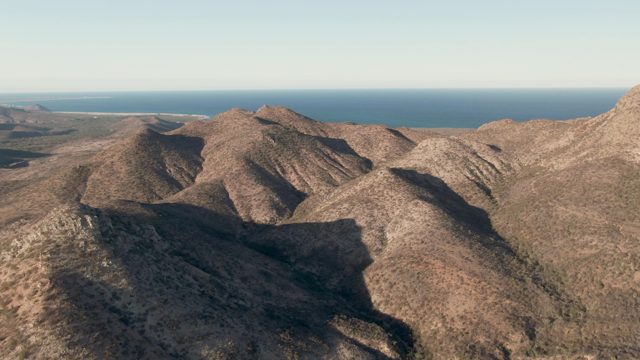 CABO PULMO BCS MEXICO-2023: Rugged Mountain Range with Distant Ocean Horizon