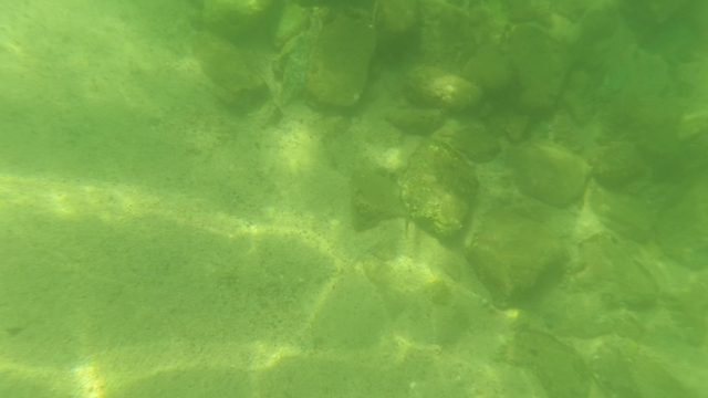 SAN JOSE DEL CABO BCS MEXICO-2023: Underwater Riverbed with Shifting Rocks and Light Patterns