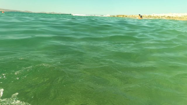 SAN JOSE DEL CABO BCS MEXICO-2023: Person Swimming in Clear Ocean Water