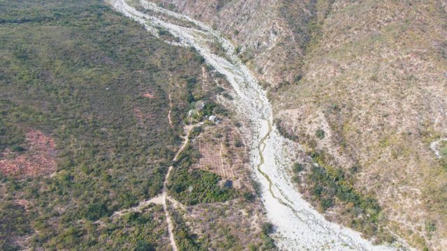 SAN DIONISIO BCS-2023: Winding River in Mountain Valley with Moving Figure
