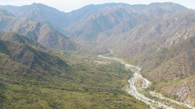 SAN DIONISIO BCS-2023: Winding River Through Mountain Valley