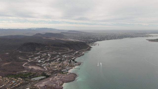 LA PAZ BCS-2023: Boat's Wake Moving Across Coastal Waters