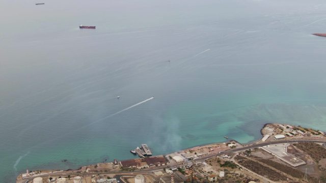 LA PAZ BCS-2023: Speedboat Creating Wake Near Industrial Shoreline