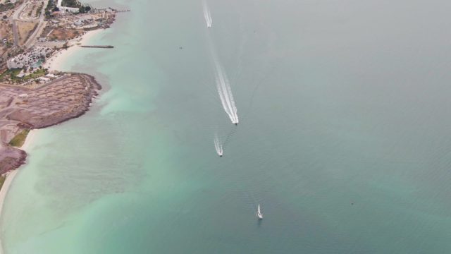 LA PAZ BCS-2023: Coastal Waters with Boat Wake and Sailboat